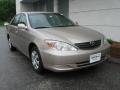 2004 Desert Sand Mica Toyota Camry LE  photo #1