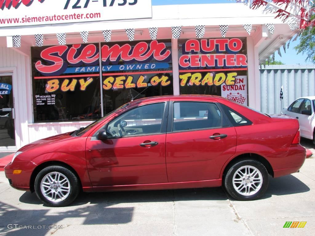 2005 Focus ZX4 SE Sedan - Sangria Red Metallic / Dark Pebble/Light Pebble photo #1