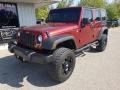 2010 Flame Red Jeep Wrangler Unlimited Sport 4x4  photo #9