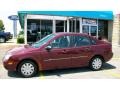 2007 Dark Toreador Red Metallic Ford Focus ZX4 SE Sedan  photo #4