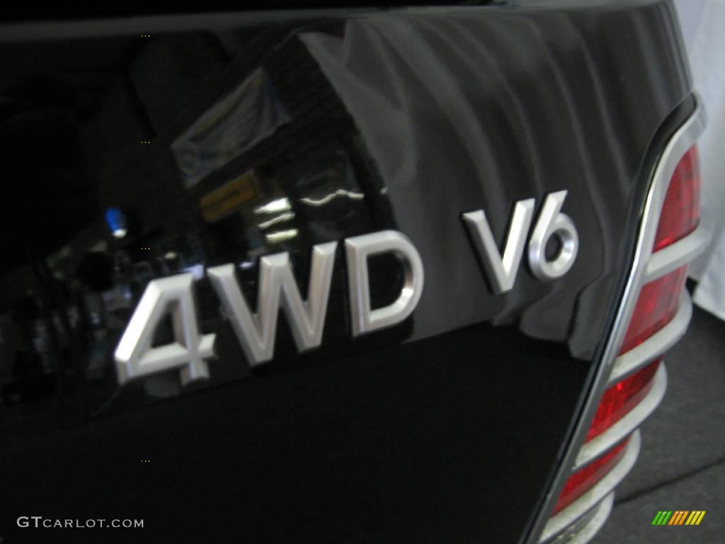2006 Mariner Luxury 4WD - Black / Black/Light Parchment photo #37