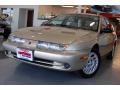 1999 Gold Saturn S Series SW2 Wagon  photo #1