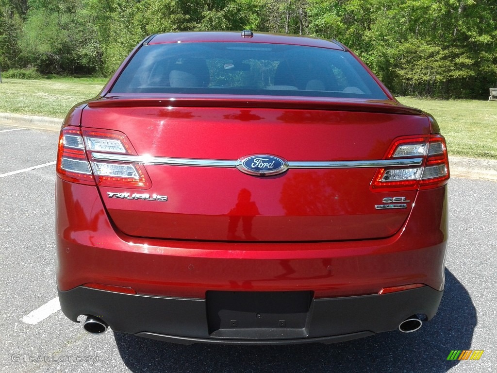 2016 Taurus SEL - Ruby Red / Charcoal Black photo #7