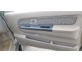 Beige 2002 Nissan Frontier XE King Cab 4x4 Door Panel