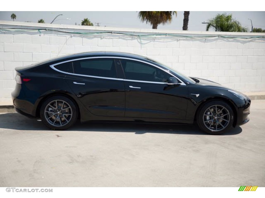 Solid Black 2019 Tesla Model 3 Standard Range Exterior Photo #139439571