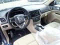 Light Frost Beige/Black Interior Photo for 2021 Jeep Grand Cherokee #139939851