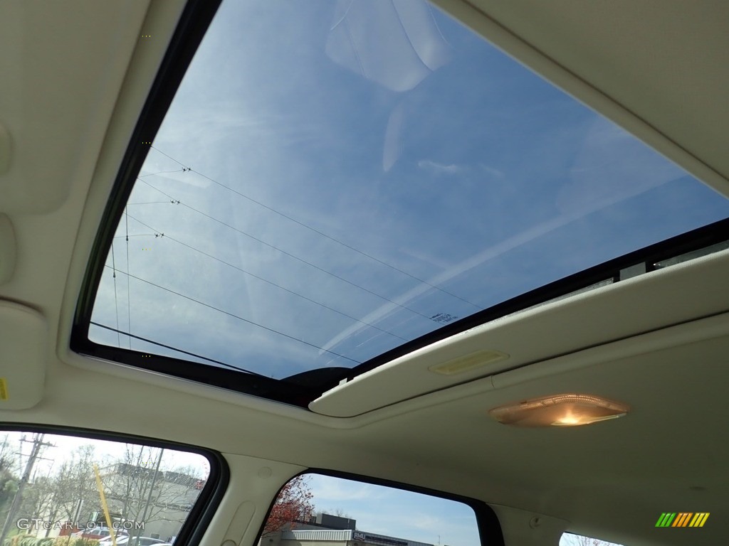 2010 Mariner V6 Premier 4WD - Sangria Red Metallic / Stone photo #12