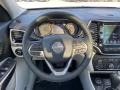 2021 Jeep Cherokee Light Frost Beige/Black Interior Steering Wheel Photo