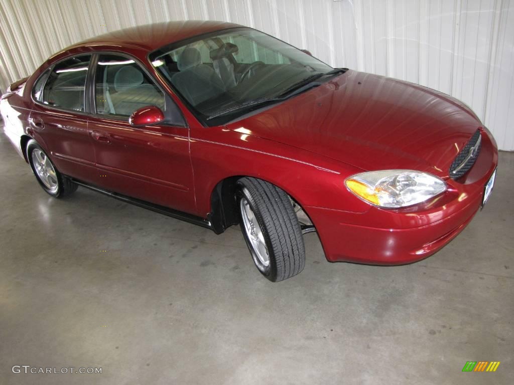 2003 Taurus SE - Matador Red Metallic / Medium Graphite photo #1