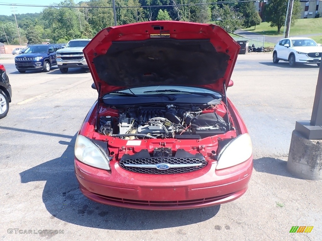 2003 Taurus SE - Matador Red Metallic / Dark Charcoal photo #5