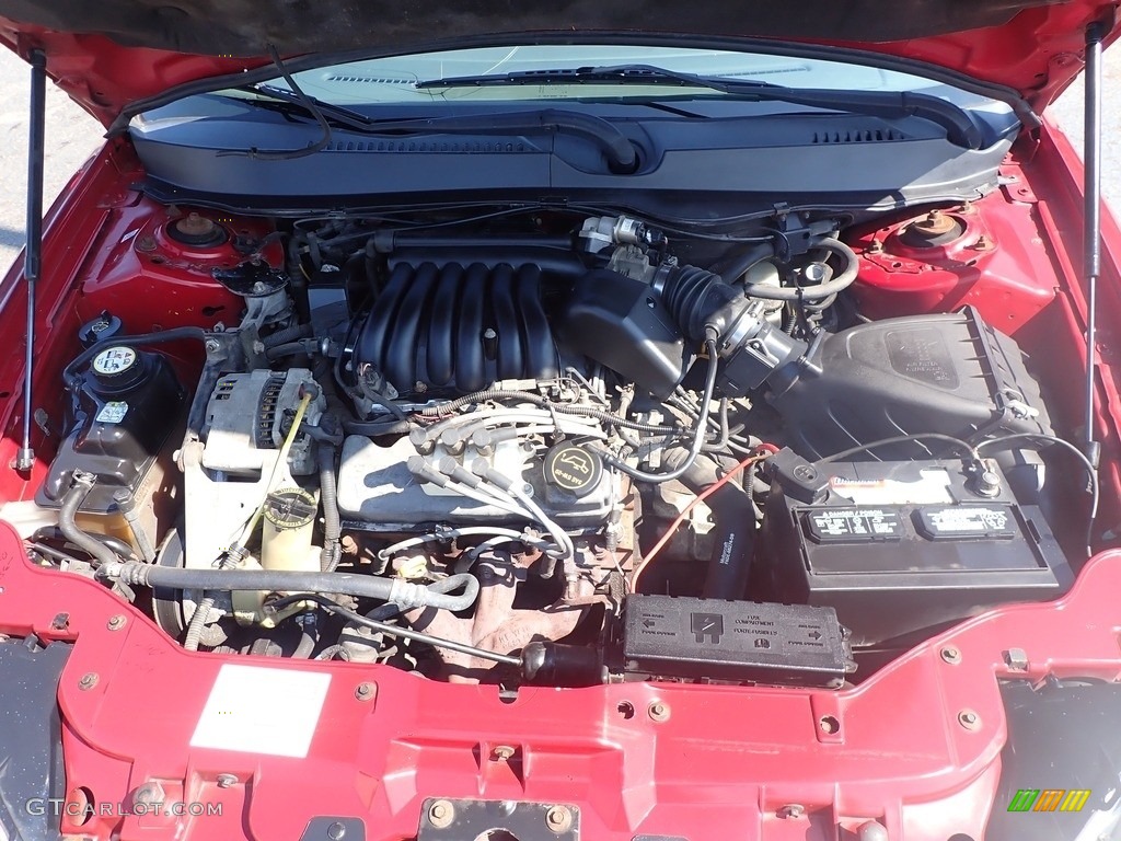 2003 Taurus SE - Matador Red Metallic / Dark Charcoal photo #6