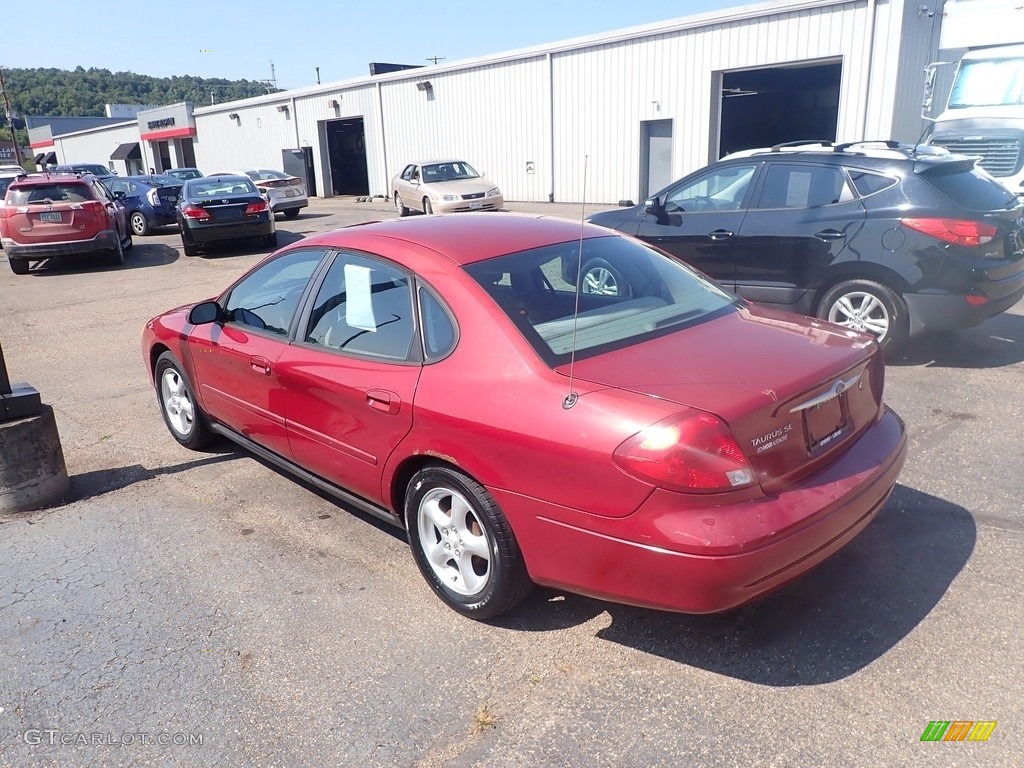 2003 Taurus SE - Matador Red Metallic / Dark Charcoal photo #9