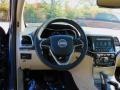 2021 Jeep Grand Cherokee Light Frost Beige/Black Interior Steering Wheel Photo