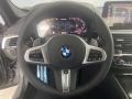 Black 2022 BMW 5 Series M550i xDrive Sedan Steering Wheel