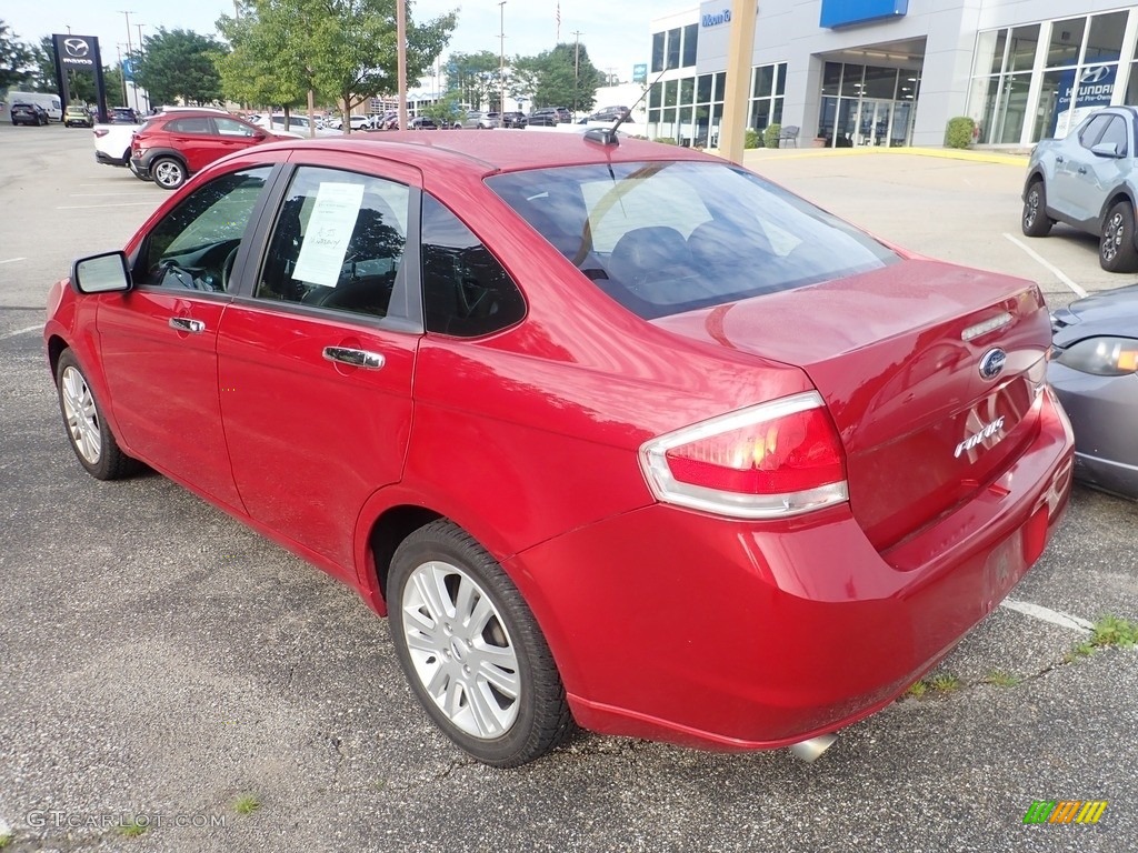 2011 Focus SEL Sedan - Ebony Black / Medium Stone photo #2