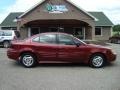 Redfire Metallic 2000 Pontiac Grand Am SE Sedan