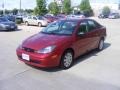 2004 Sangria Red Metallic Ford Focus SE Sedan  photo #4