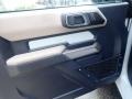 2021 Ford Bronco Sandstone/Black Onyx Interior Door Panel Photo