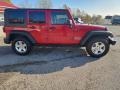 2010 Flame Red Jeep Wrangler Unlimited Sport 4x4  photo #21