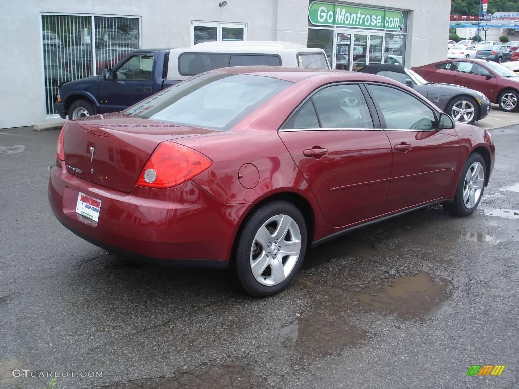 2009 G6 Sedan - Performance Red Metallic / Ebony photo #2