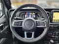 Black 2023 Jeep Wrangler Unlimited Sahara 4XE Hybrid Steering Wheel