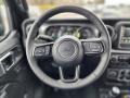 Black 2023 Jeep Wrangler Unlimited Sahara 4XE Hybrid Steering Wheel