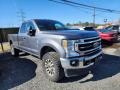 Front 3/4 View of 2021 F250 Super Duty Lariat Crew Cab 4x4