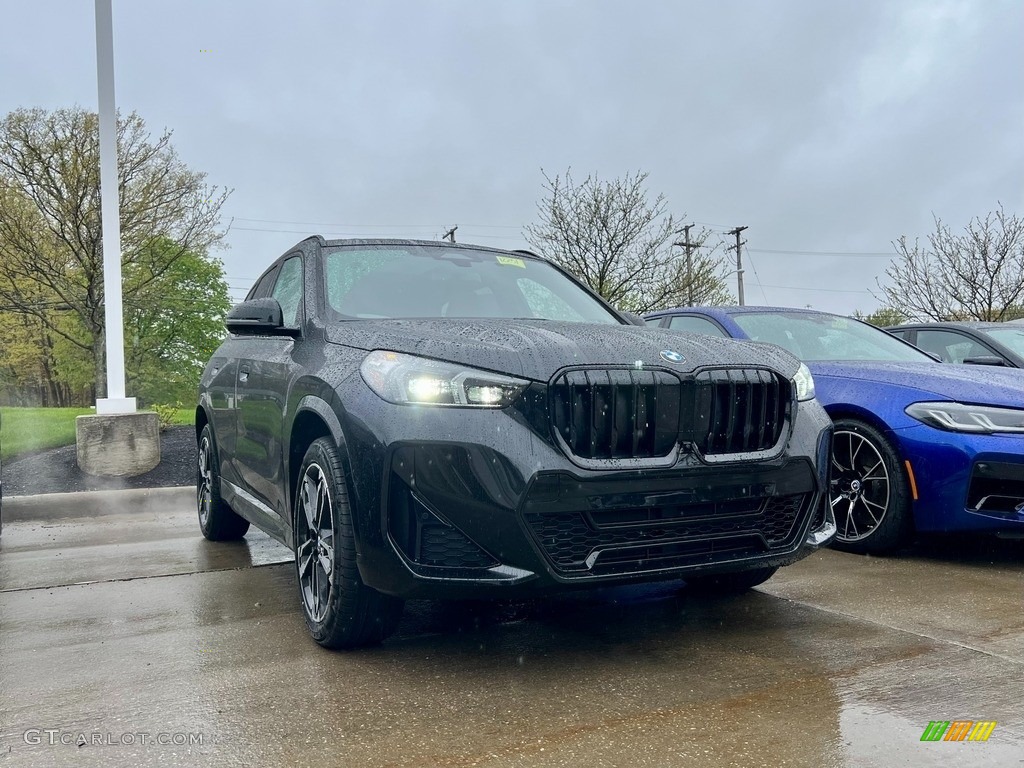 2023 X1 xDrive28i - Black Sapphire Metallic / Red/Black Bicolor photo #1