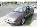 1999 Brown Saturn S Series SL2 Sedan  photo #1