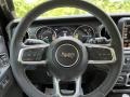 Black 2023 Jeep Wrangler Unlimited Sahara 4XE Hybrid Steering Wheel