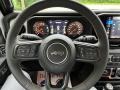 Black 2024 Jeep Wrangler 4-Door Sport S 4x4 Steering Wheel