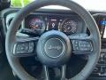 Black 2024 Jeep Wrangler 4-Door Sport S 4x4 Steering Wheel