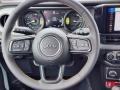 Black 2024 Jeep Wrangler 4-Door Willys 4xe Hybrid Steering Wheel