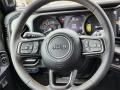 Black 2024 Jeep Wrangler 4-Door Willys 4xe Hybrid Steering Wheel