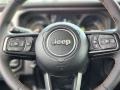 Black 2024 Jeep Wrangler 4-Door Willys 4xe Hybrid Steering Wheel