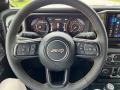Black 2024 Jeep Wrangler 4-Door Sport S 4x4 Steering Wheel