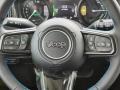 Black 2024 Jeep Wrangler 4-Door Rubicon 4xe Hybrid Steering Wheel