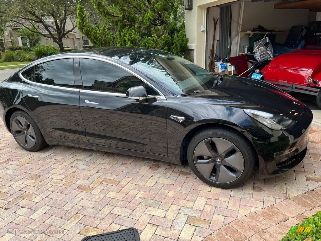 Solid Black 2019 Tesla Model 3 Standard Range Exterior Photo #146575621
