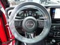 Black 2024 Jeep Wrangler 4-Door Sport S 4xe Hybrid Steering Wheel