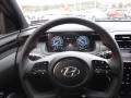 Black 2024 Hyundai Tucson N-Line Hybrid AWD Steering Wheel