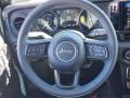 Black 2024 Jeep Wrangler 4-Door Rubicon 4xe Hybrid Steering Wheel