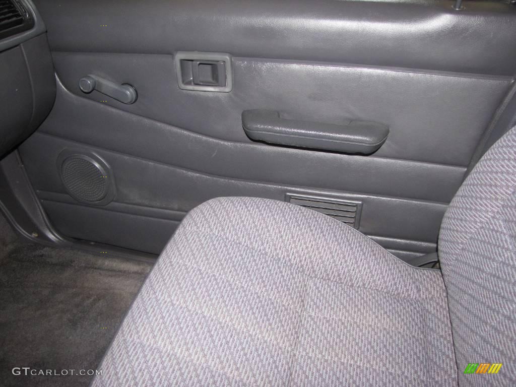 1997 Hardbody Truck XE Extended Cab 4x4 - Vivid Teal Pearl Metallic / Dark Gray photo #16