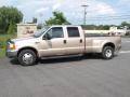 1999 Pueblo Gold Metallic Ford F350 Super Duty XLT Crew Cab Dually  photo #1