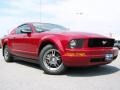 2008 Dark Candy Apple Red Ford Mustang V6 Deluxe Coupe  photo #1