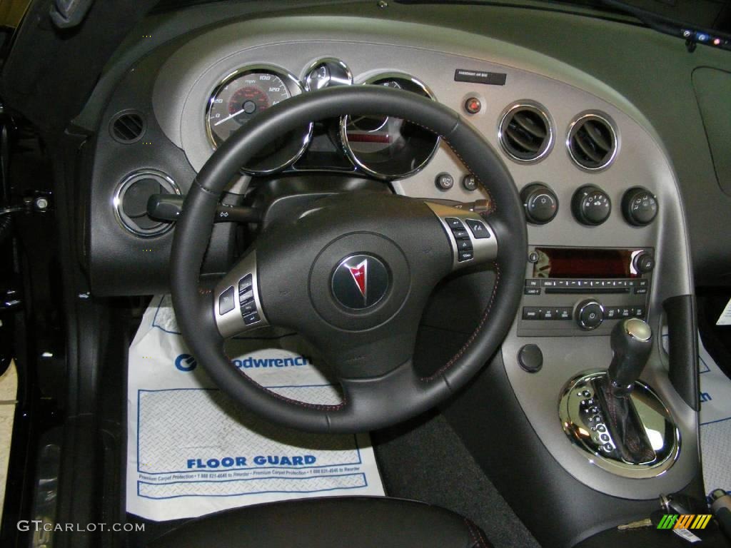 2009 Solstice GXP Coupe - Mysterious Black / Ebony/Red Stitching photo #10