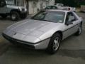 Silver 1986 Pontiac Fiero 2M4