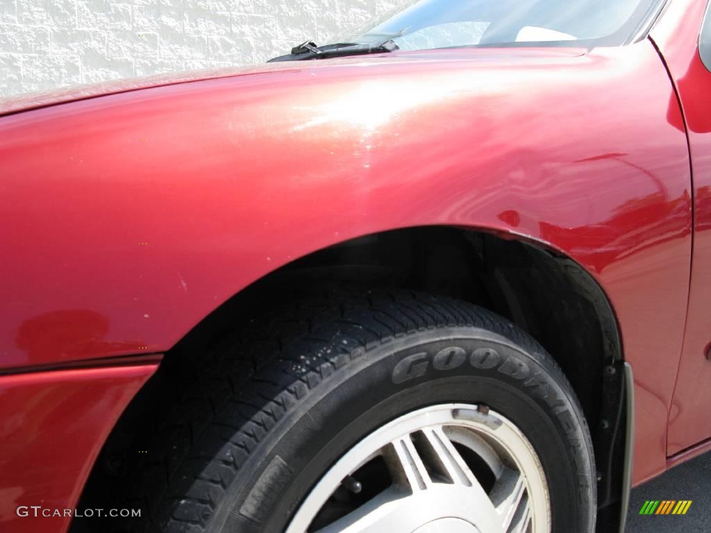 1997 Cavalier LS Sedan - Cayenne Red Metallic / Graphite photo #7