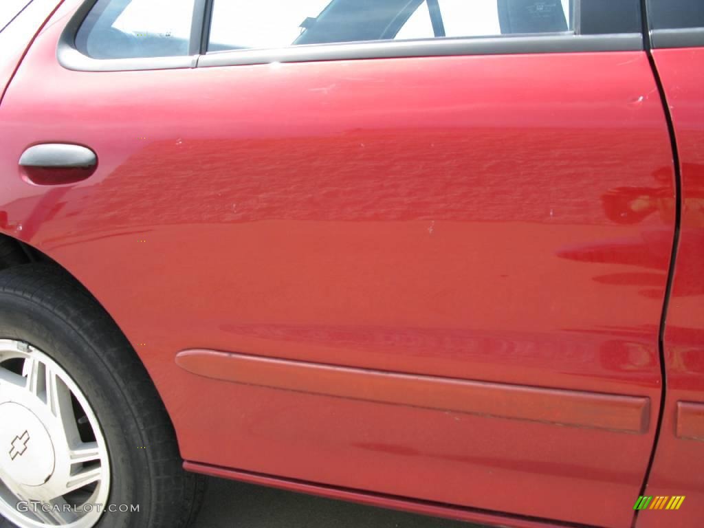1997 Cavalier LS Sedan - Cayenne Red Metallic / Graphite photo #15