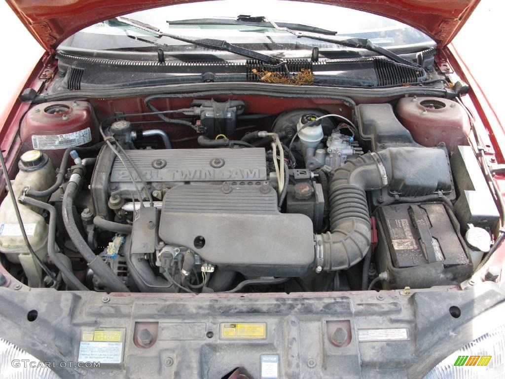 1997 Cavalier LS Sedan - Cayenne Red Metallic / Graphite photo #56