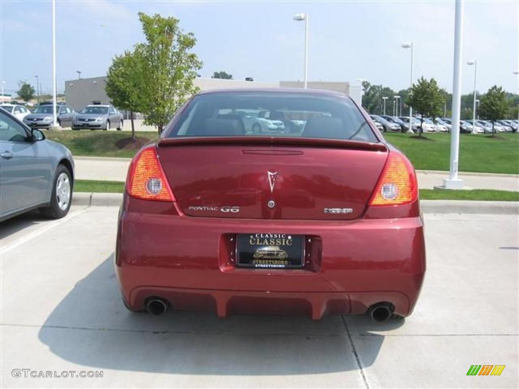 2009 G6 GXP Sedan - Performance Red Metallic / Ebony photo #3